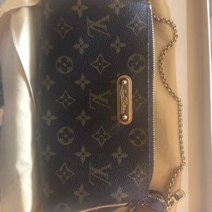 LV monogram EVA clutch .